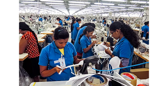 Workers in a garment manufacturing unit